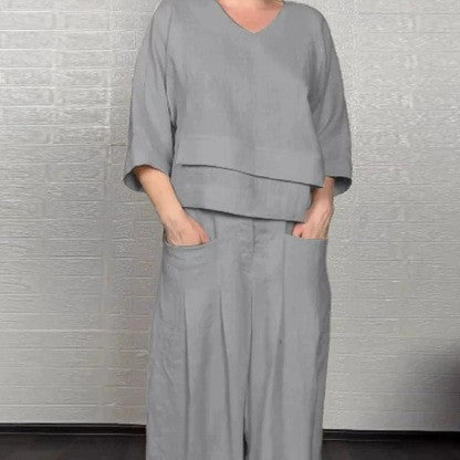 💎 Dwuczęściowy komplet z bawełny i lnu z nieregularnym dołem – bluzka z dekoltem w serek + spodnie z szerokimi nogawkami, przewiewny i naturalnie elegancki 🍂👚
